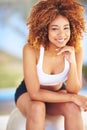 All it takes is all you got. a sporty young woman sitting on a swiss ball. Royalty Free Stock Photo