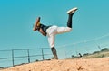 All it takes is all youve got. Shot of a young baseball player pitching the ball during a game outdoors. Royalty Free Stock Photo
