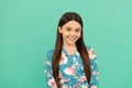 All the taste of being a girl. Happy girl child smile blue background. Girlhood and childhood Royalty Free Stock Photo