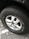 All terrain car tire on a wheel