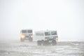 The all-terrain vehicle for snow trips to a snow blizzard in the tundra. Special car for the Arctic safari. Royalty Free Stock Photo