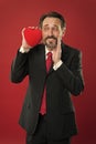 All thoughts about love. February holiday. Love and romance health care. Happy man with big red heart. mature man hold Royalty Free Stock Photo