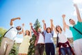 All together! Low angle view of happy students with raised arms Royalty Free Stock Photo