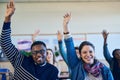 We all want more in life. a group of students raising their hands in class. Royalty Free Stock Photo
