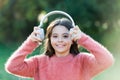 All she wants to hear is music. Adorable little girl outdoor. Little girl child wearing headphones. Happy child enjoy Royalty Free Stock Photo