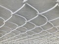 all white steel wire net on a white detail net wall in a close-up shot Royalty Free Stock Photo