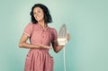 All you need is iron. Retro woman ironing clothes. Housekeeper in retro dress with iron. Order services. good wife Royalty Free Stock Photo