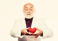 All you need is love. bearded businessman. heart failure. love and romance. World heart day. mature man hold red heart