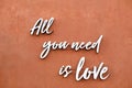 All you need is love - inspirational quote on a wall