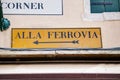 Alla Ferrovia direction sign in Venice Royalty Free Stock Photo
