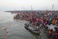 Hindu devotees come to confluence of the Ganges for holy dip during the festival Kumbh Mela Royalty Free Stock Photo