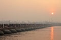 Thousands of Hindu devotees crossing the pontoon bridges over the Ganges River at Maha Kumbh Mela festival Royalty Free Stock Photo