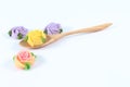 Allauch candy roses wooden spoon on white background Royalty Free Stock Photo