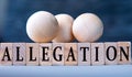 ALLEGATION - word on wooden blocks on dark blue background Royalty Free Stock Photo