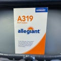 An Allegiant airplane brochure containing safety information about the airplane that is found in the seat back pocket