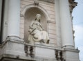 Allegorical statue of a seated woman with a dagger, depicting a tragedy