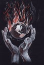 Allegorical symbolic meaning. The planet Earth is in women`s hands. it is in danger and is engulfed in flames
