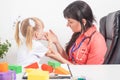 An allergist doctor examines a child s hand with redness and a rash on her skin. The concept of dermatitis and urticaria