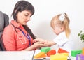 An allergist doctor examines the hand of a little girl for allergies. The concept of allergy to insect bites, dust and medications