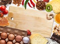 Collage of allergic food on white wooden background, top view