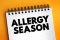 Allergy Season - in many areas allergies begin in february and last until the early summer, text concept on notepad Royalty Free Stock Photo