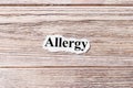 Allergy of the word on paper. concept. Words of Allergy on a wooden background
