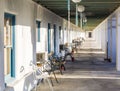 allery and patio with chairs in front of the rooms of an old hotel in village Death valley Junction Royalty Free Stock Photo