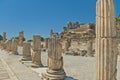 Alley with ancient columns on sunny day