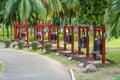 The alley Bells with chinese hieroglyphs on the territory of Buddhist center Nanshan