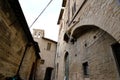 Alley of the city of Assisi with stone facades of historic houses. .Narrow alleys of the city with the walls of the stone houses.