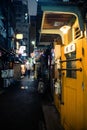 Alley at the Golden Gai, Shinjuku at night. Raining day. Portrait Orientation