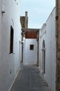 Alley in Greece, narrow, white and with charm.