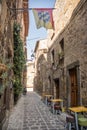 Alley in the historic center of Bolsena with restaurant tables