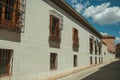 Alley and old building with protective iron grids on windows at Avila Royalty Free Stock Photo