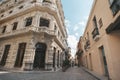 alley in old Havana between a rich and a poor house. Beautiful facade of the building in the colonial style. Contrast of cheap and Royalty Free Stock Photo