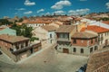 Alley among old houses and stone wall around the town of Avila