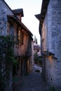 alley and old stone half-timbered houses in saint-cirq-la-popie (france)