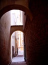 Alley in the old town in Warsaw, gate between tenement houses Royalty Free Stock Photo