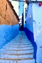 Alley that is painted in shades of blue