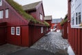 Alley through red buildings in the government district of Tinganes in Torshavn, Faroe Islands