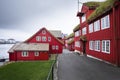 Alley through red buildings in the government district of Tinganes in Torshavn, Faroe Islands