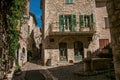 Alley with square, stone houses and fountain in Saint-Paul-de-Vence. Royalty Free Stock Photo