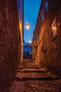 Alley with steps and stone houses at night Royalty Free Stock Photo