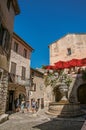 Alley with stone houses and fountain in Saint-Paul-de-Vence Royalty Free Stock Photo