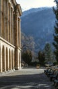 Square with benches and Parking in front of the recreation center `Mountain Armenia` on the background of snow-covered mountains c