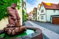 Alleyway with fontain and statue in Lohr am Main, Germany