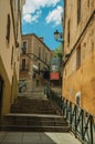 Alleyway with staircase on slope amidst old buildings at Caceres