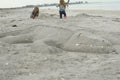 Alligator sculpture in the sand