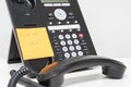 Alling back message on sticky note attach to IP phone Royalty Free Stock Photo