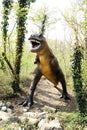 Allosaurus Dinosaur Statue Standing at the Forest Royalty Free Stock Photo